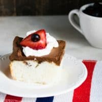 White Poke Cake With Chocolate Ganache and Berries