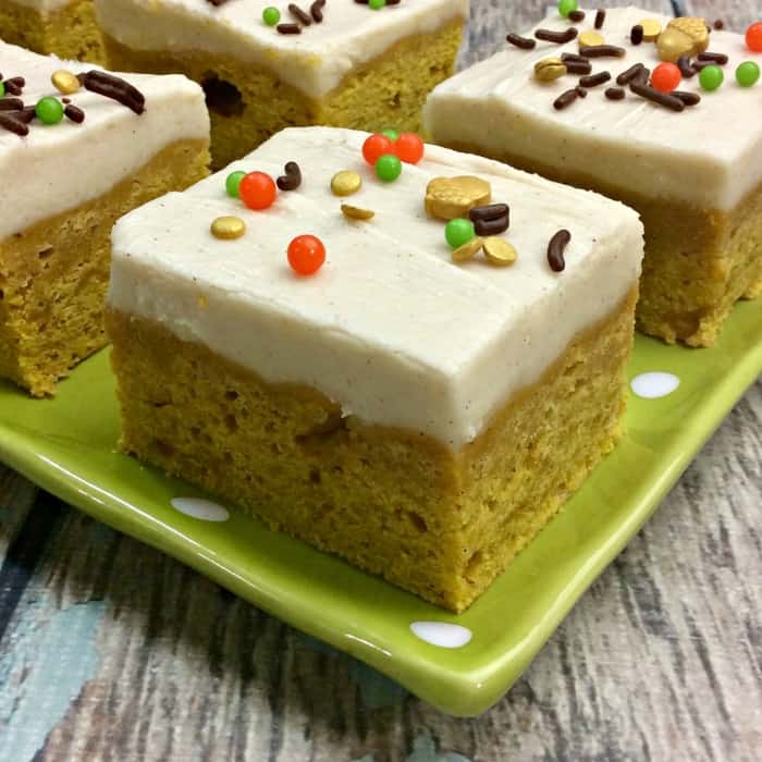 Here is a great pumpkin square recipe with homemade cream cheese frosting. The perfect fall dessert to serve up for your friends and family this season. #fall #dessert #pumpkin #pumpkinspice #bars #squares #potluck #easy pumpkin bars from scratch