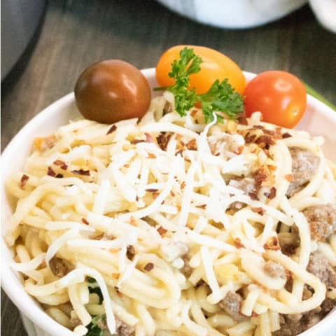 heirloom tomato pasta with ground beef in a bowl