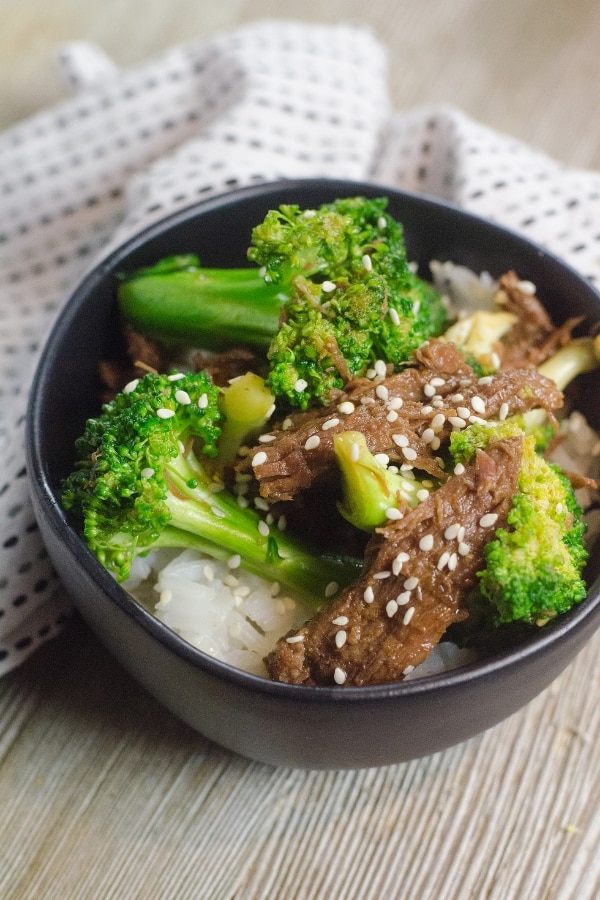 beef and broccoli in a bowl on table