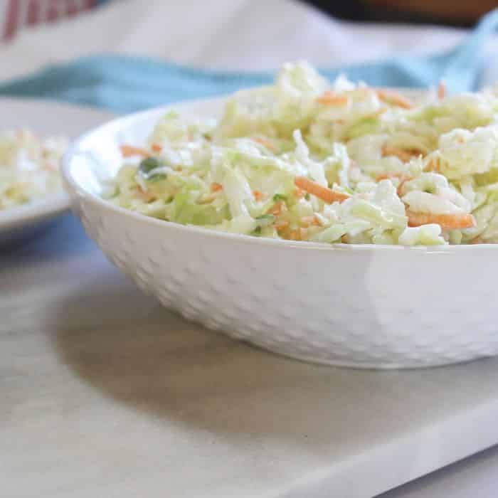  coleslaw in a white bowl on counter 