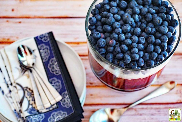 red white and blue trifle on table with silverware by it