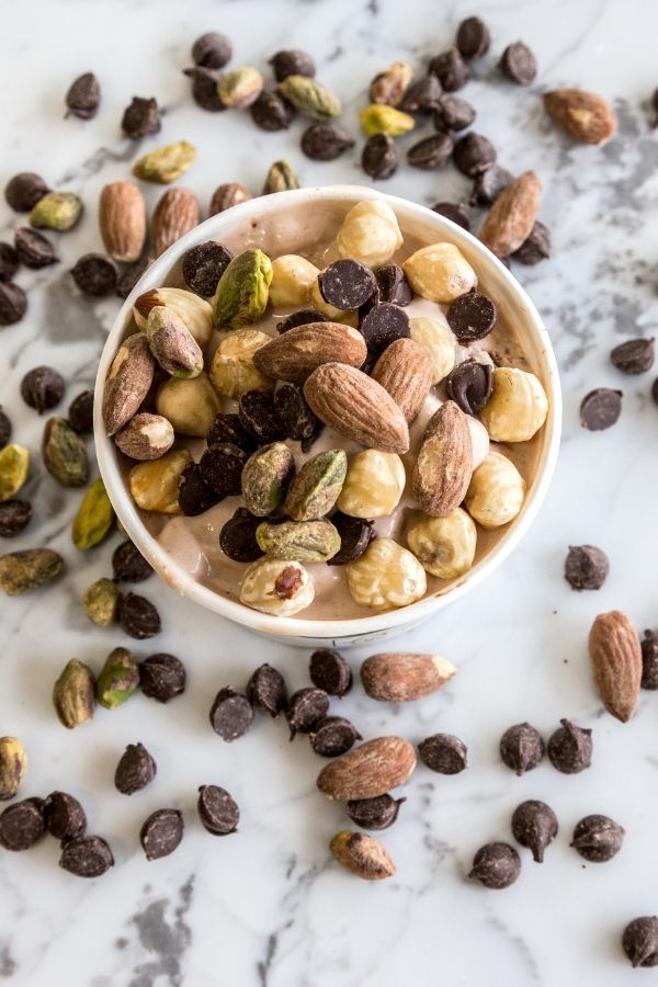 marble countertops with nuts and chocolate chips on top 