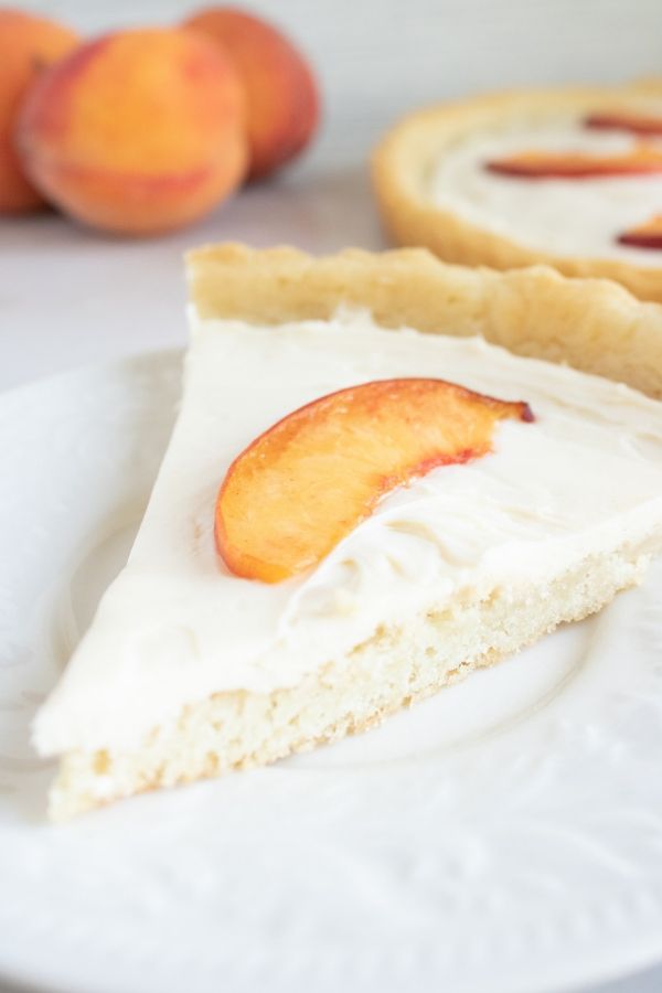 slice of peach tart on table