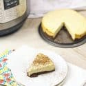 instant pot keto cheesecake on a plate with cheesecake behind it