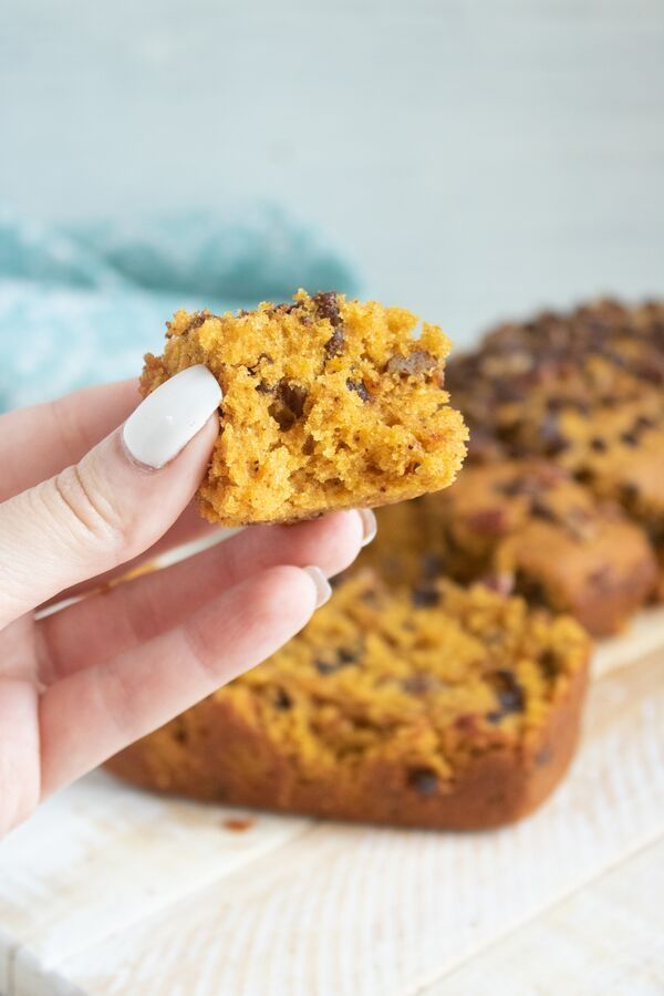 chocolate chip pumpkin bread being held in hand 