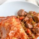 beef pot pie on a white plate on table