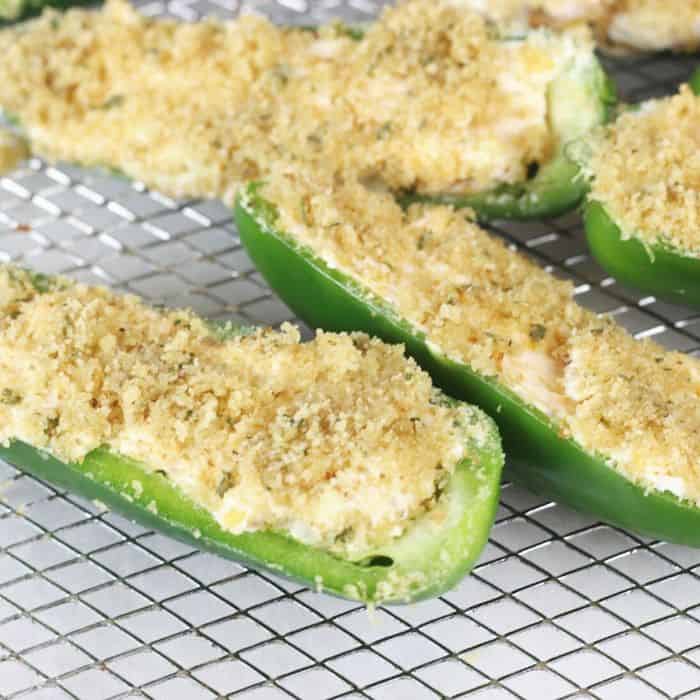 side view of jalapenos with breadcrumb mixture on top 