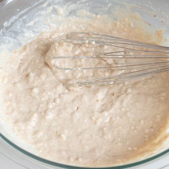 pancake batter in a bowl with whisk