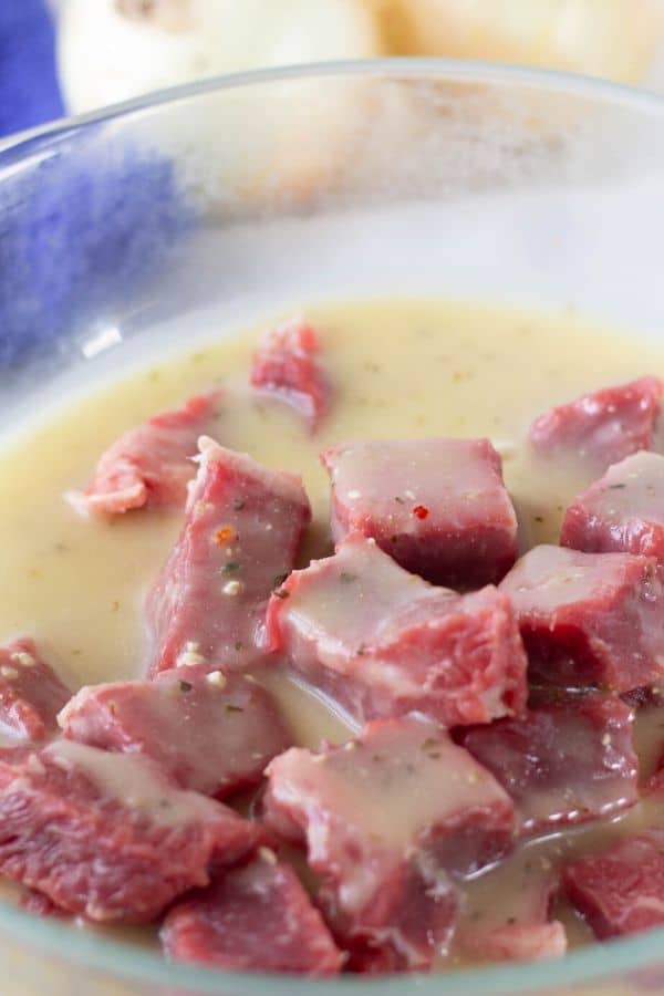 marinated steak in a bowl 