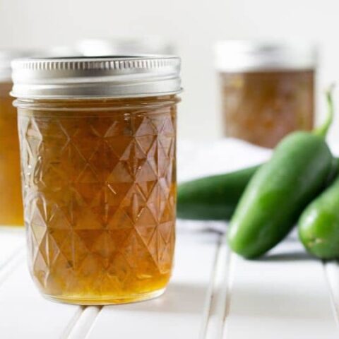 jalapeno jelly with fresh jalapenos by it