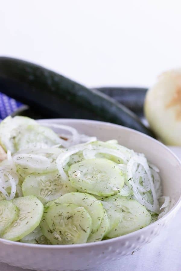 cucumber summer salad in white bowl 