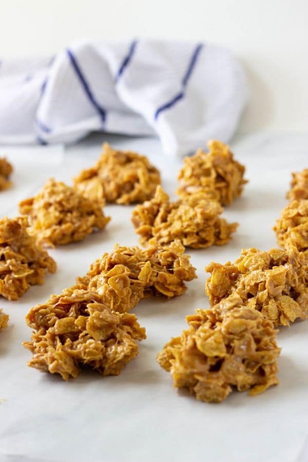 no bake peanut butter cornflake cookies on a table 