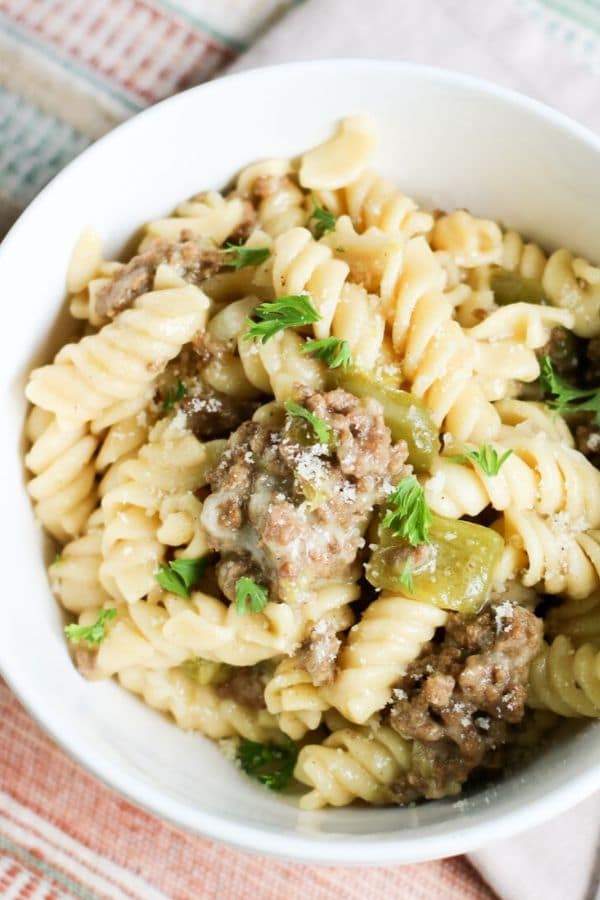 cheesesteak pasta in a white bowl 