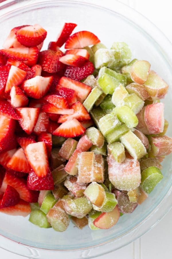 rhubarb recipe with strawberries in a bowl with it 