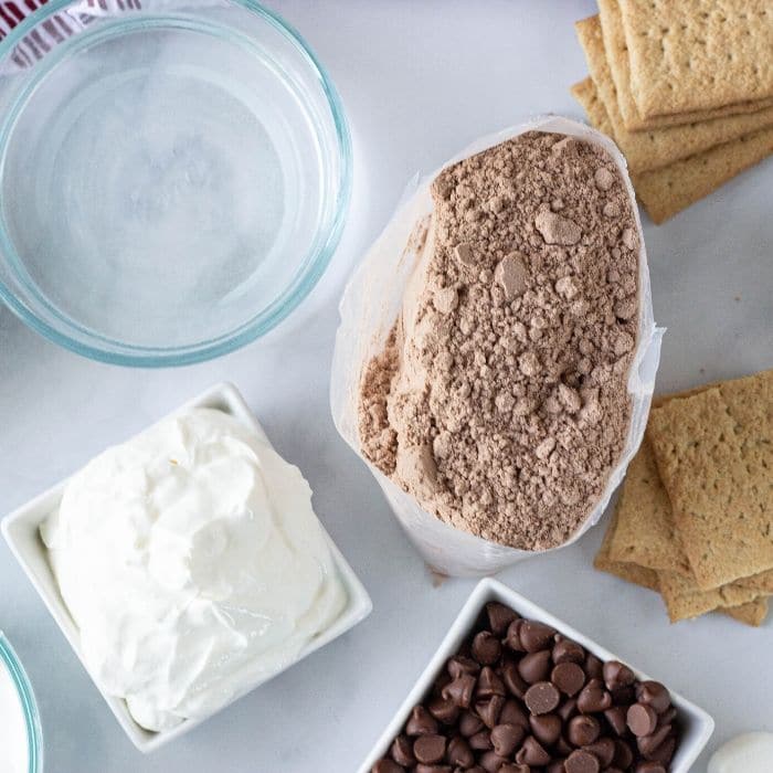 smores cake ingredients on a marble table 