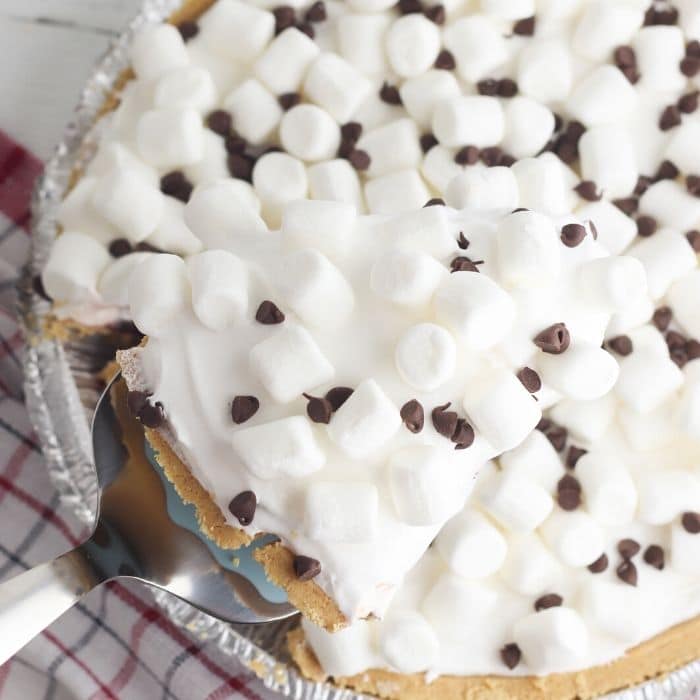 taking a slice out of the no bake smores pie