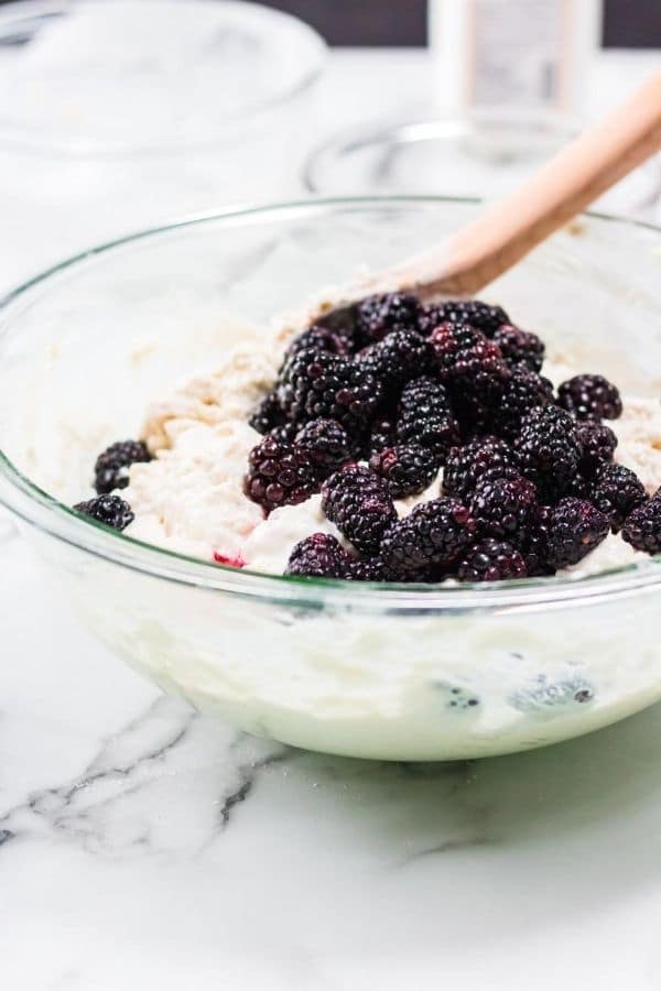 blackberry biscuit batter in a glass bowl