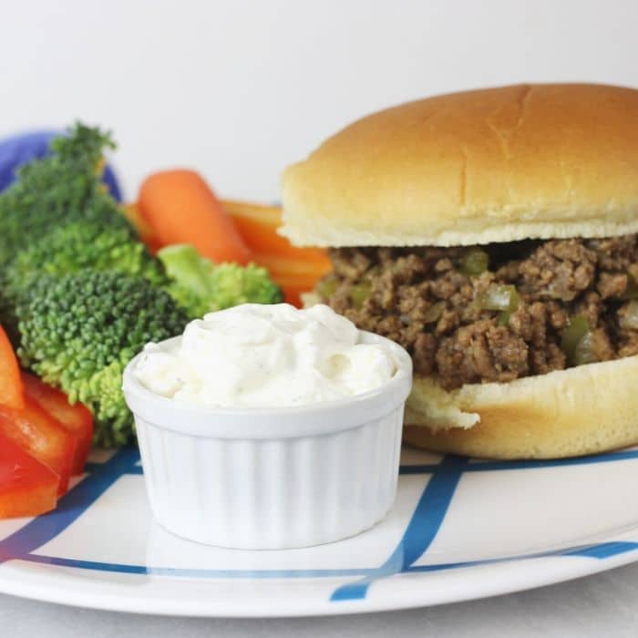 crumble burger on plate with veggies 