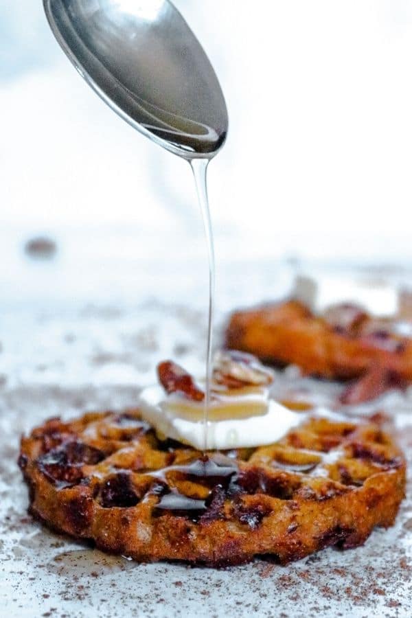 syrup being drizzled on pumpkin chaffle