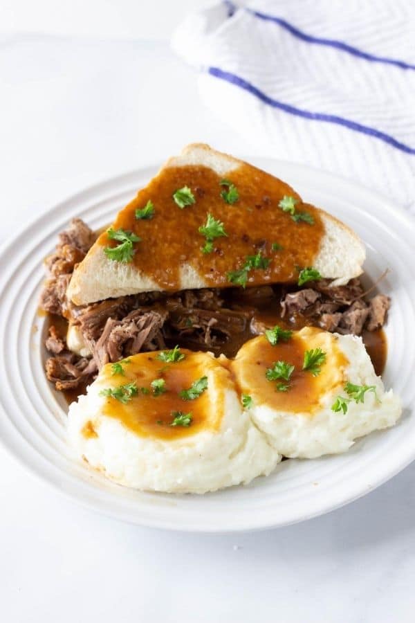 hot roast beef sandwich on a plate with mashed potatoes 