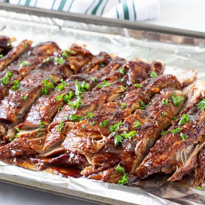 instant pot ribs on an aluminum foil lined pan