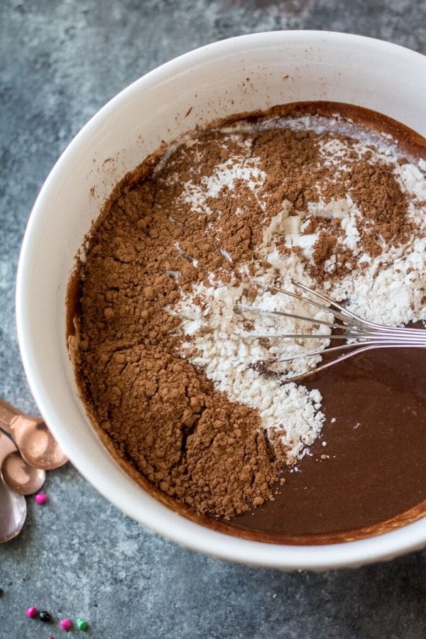 brownie batter in a bowl with whisk 