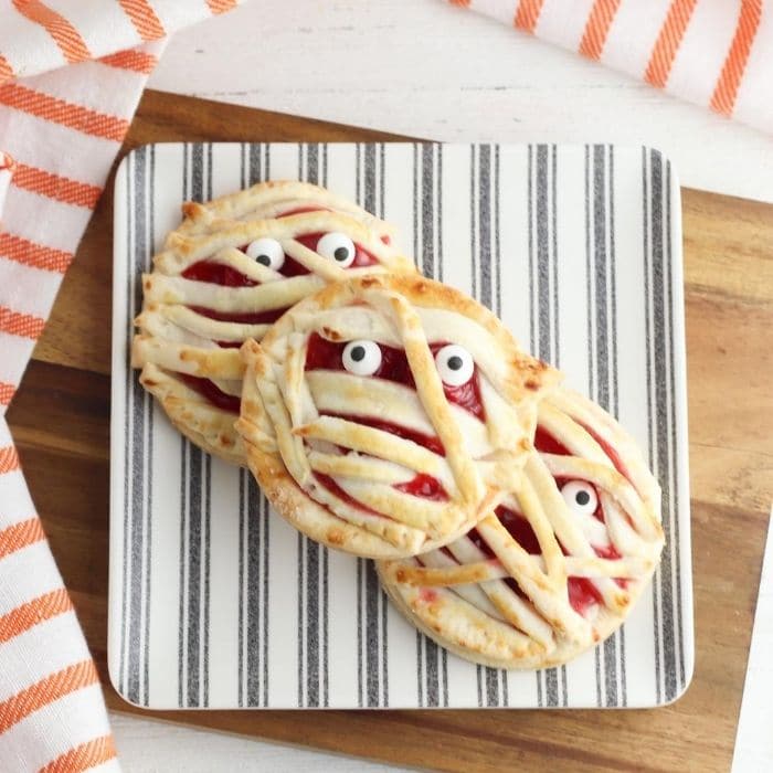 stack of Halloween pies on cutting board