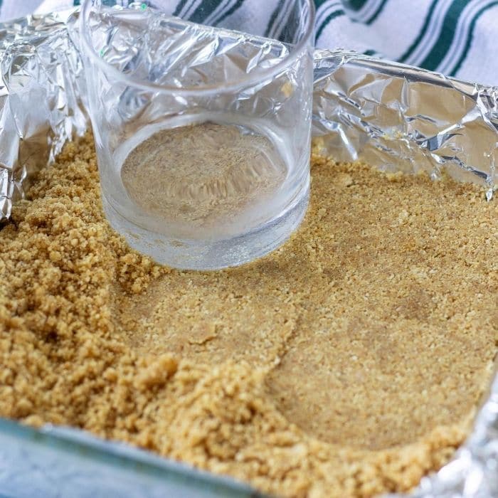 packing graham cracker crust down