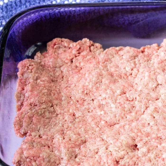 ground beef pressed into 9x13 pan
