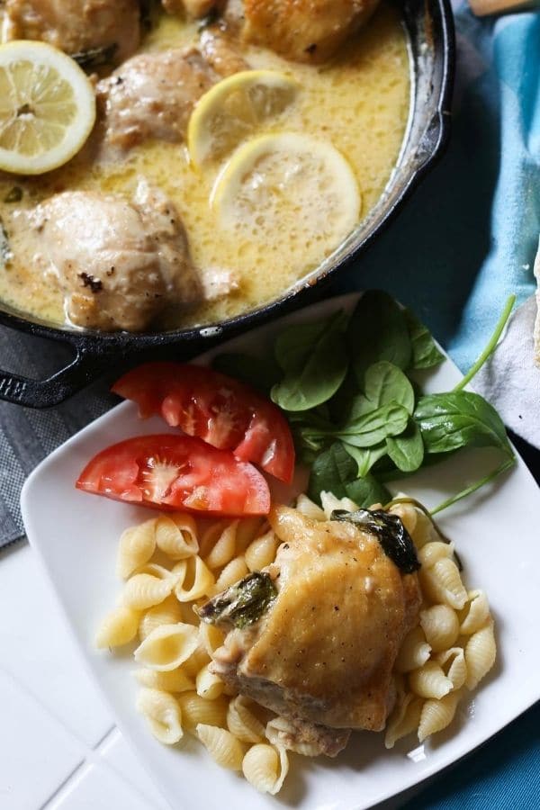 lemon garlic butter chicken in a skillet and plate 