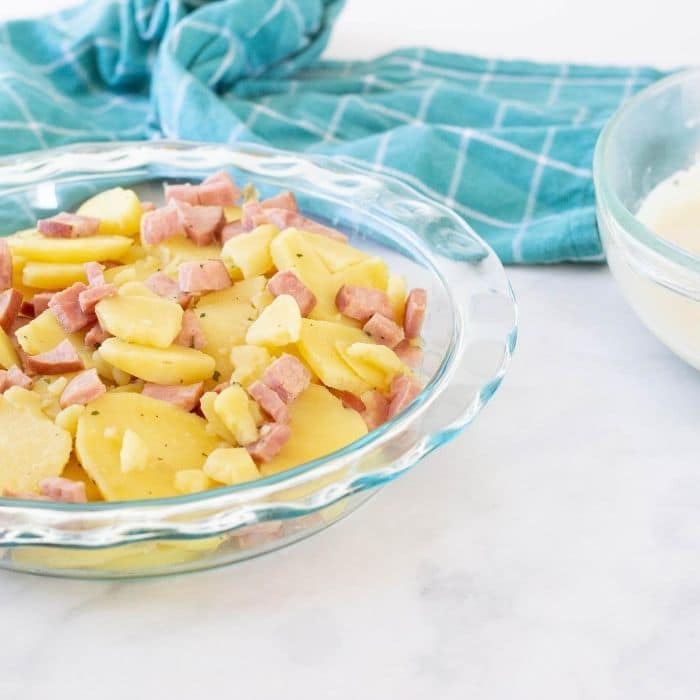 potatoes and ham in baking pan 