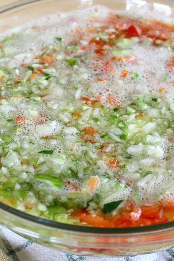 chopped vegetables soaking in water and salt