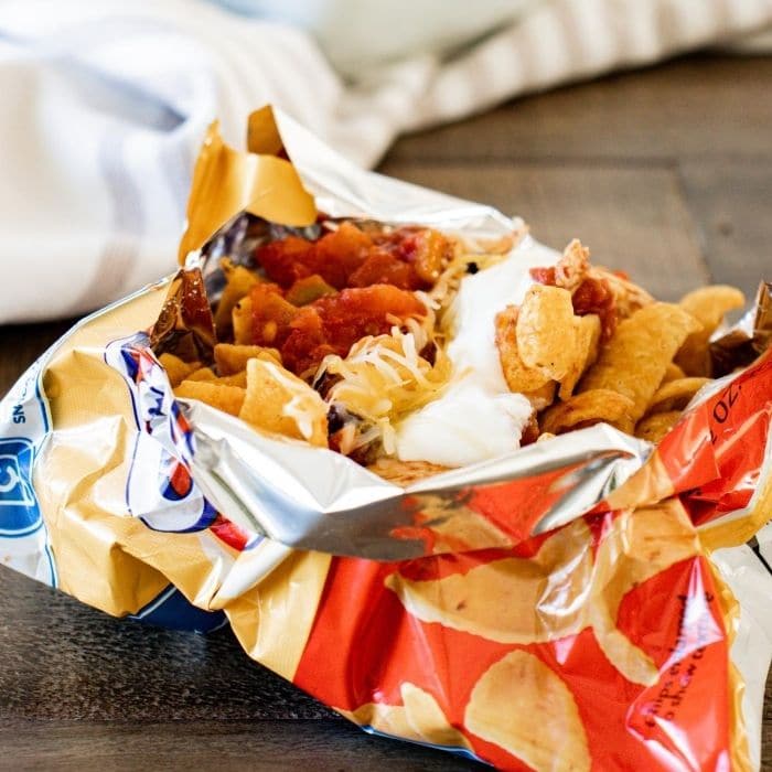 shredded chicken walking taco in frito bag on counter 