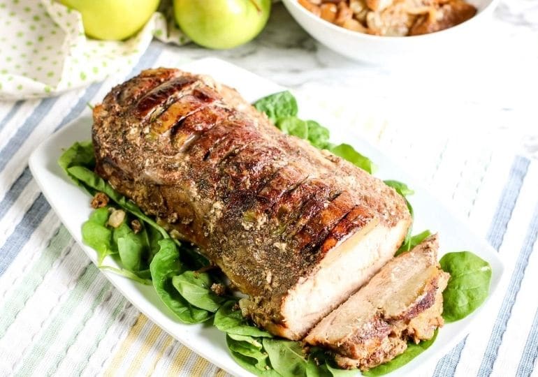 pork loin plated up with greens under it