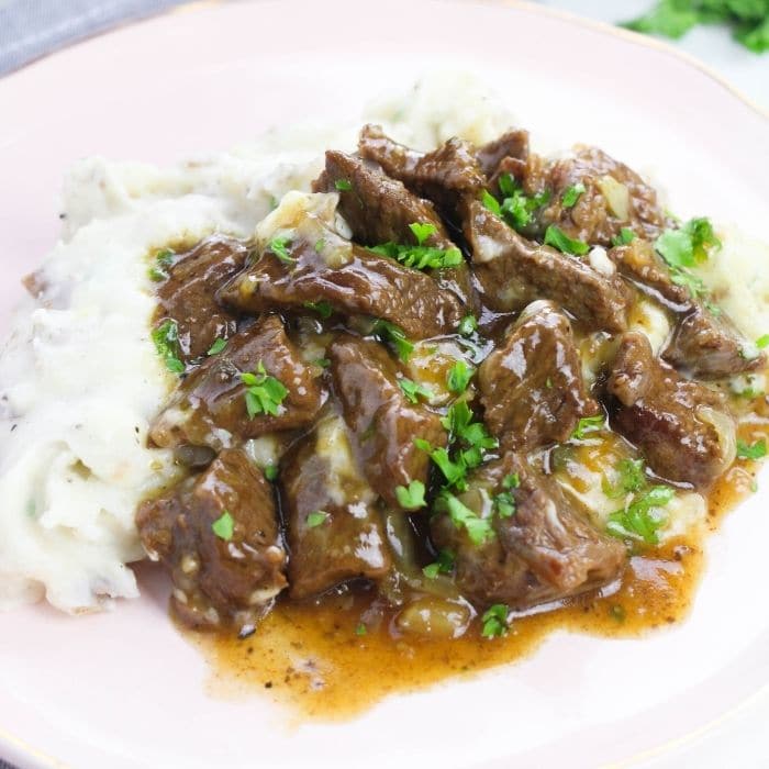 plate of potatoes and beef and gravy 