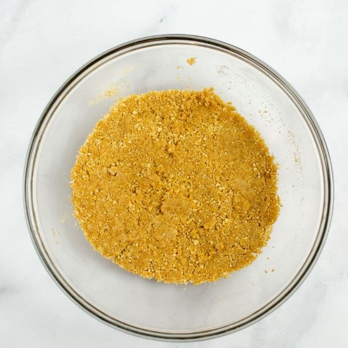 graham cracker crust mixture in bowl 