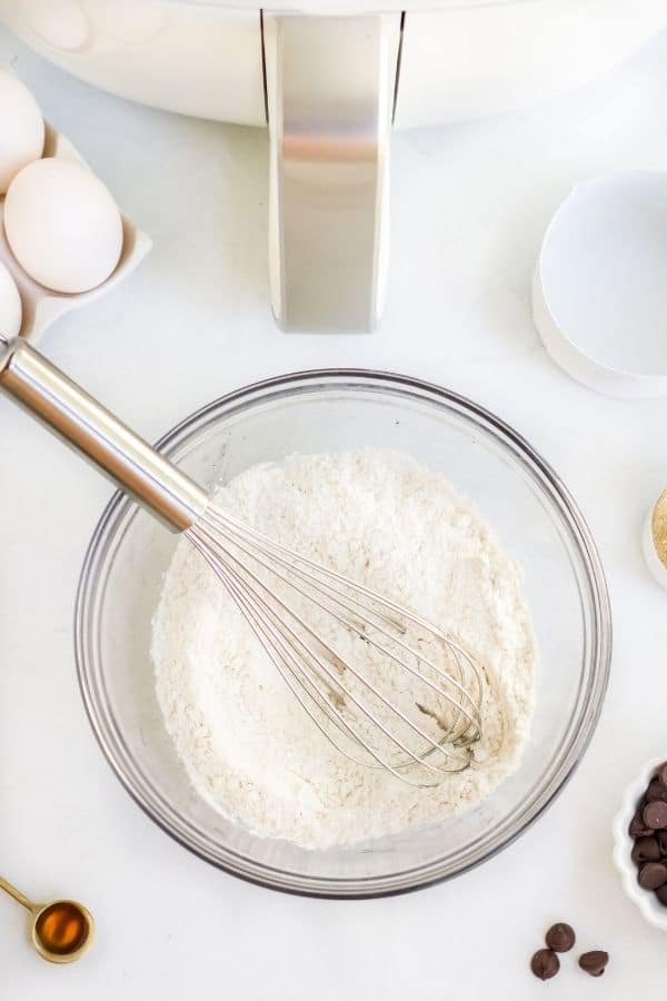 dry ingredients in bowl with whisk 