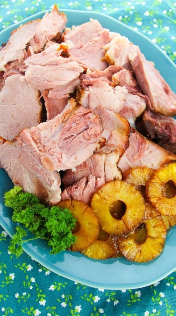 baked ham sliced up on a platter
