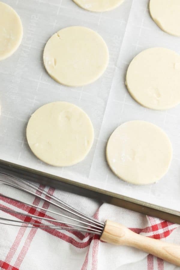 cut out sugar cookies on tray 