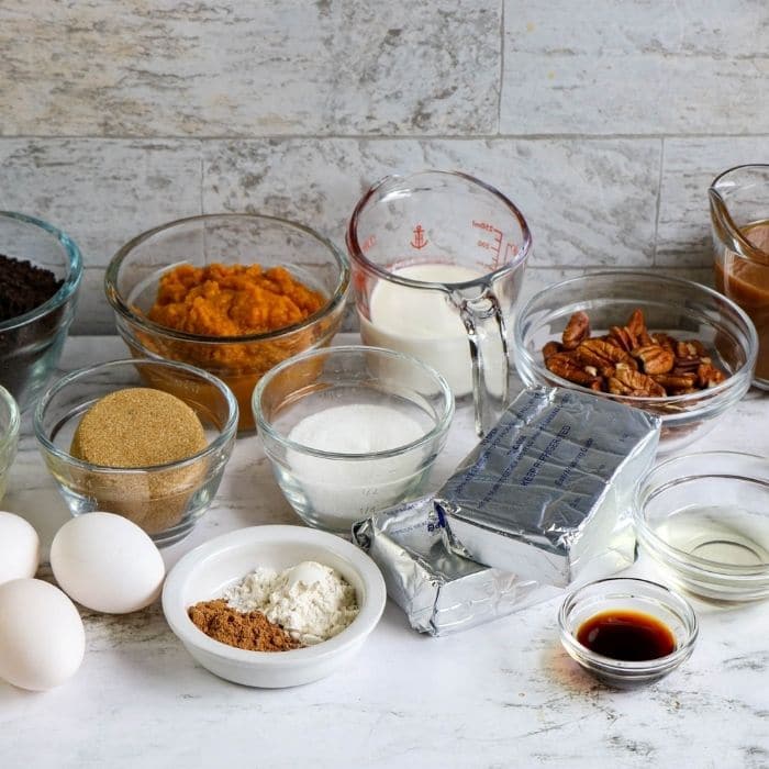 ingredients for pumpkin turtle cheesecake on counter 