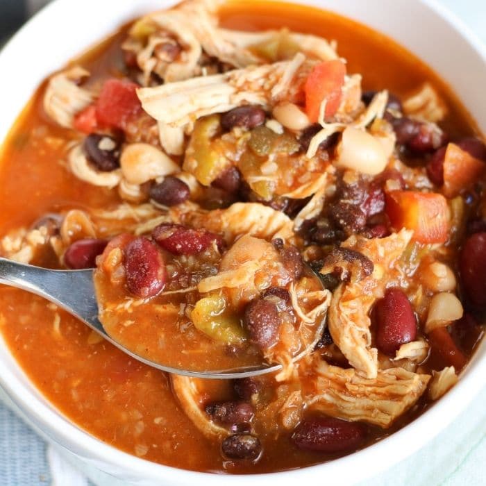 bowl of chicken chili with spoon in bowl 