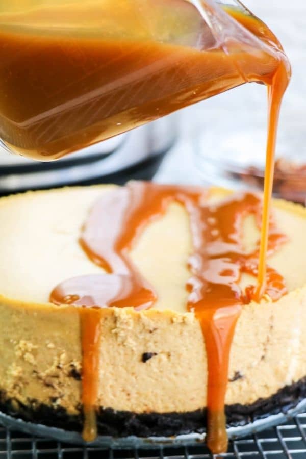 caramel pouring over cheesecake