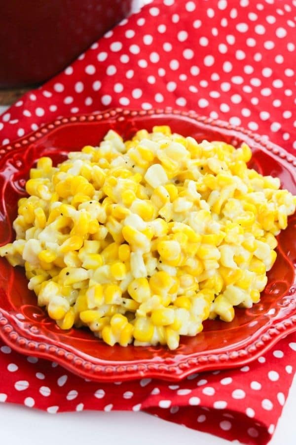 homemade creamed corn on a red plate 