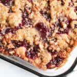banana cranberry coffee cake in a glass container