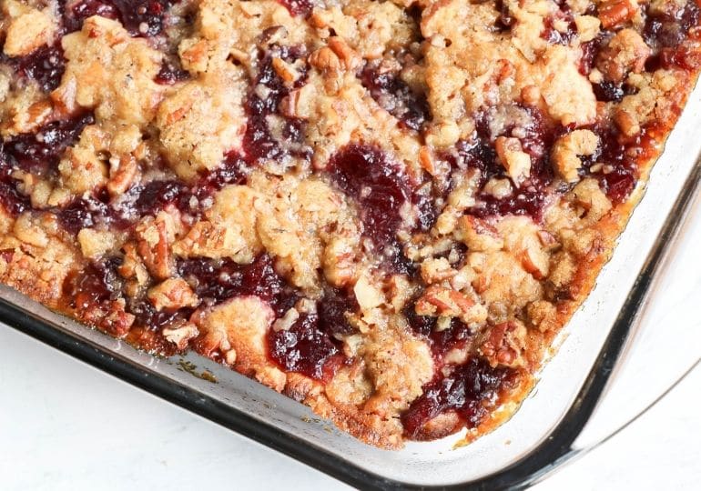 banana cranberry coffee cake in a glass container