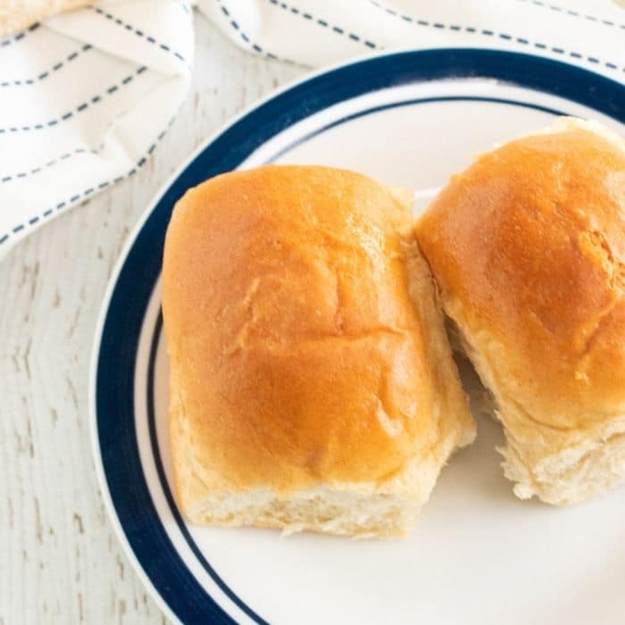 butter dinner rolls on a plate