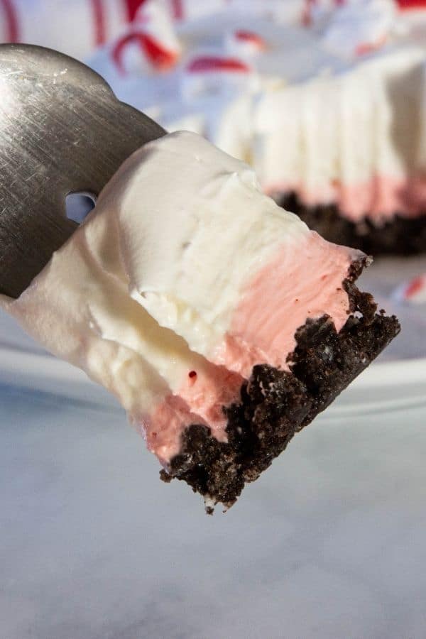 fork with layered peppermint dessert on it