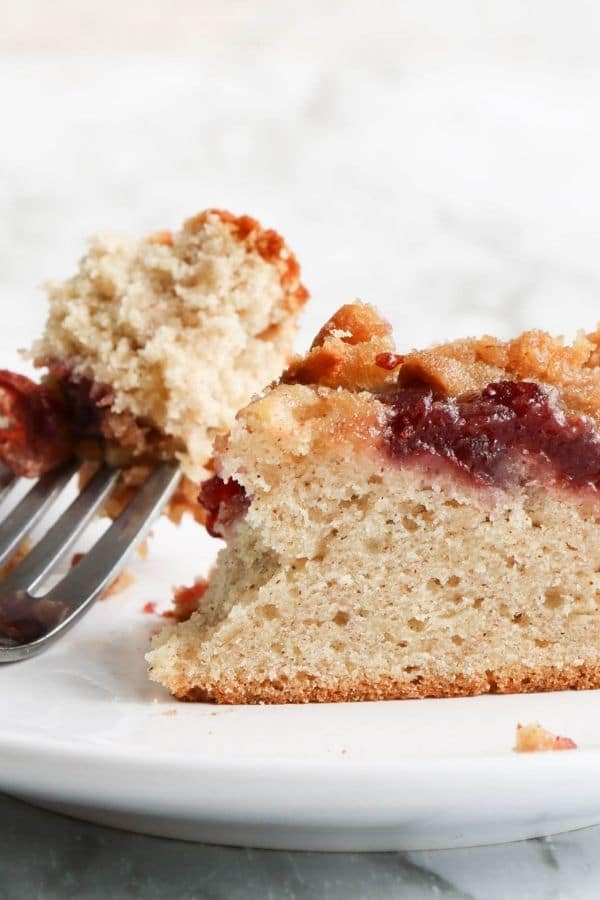 cranberry banana coffee cake on a plate with a fork