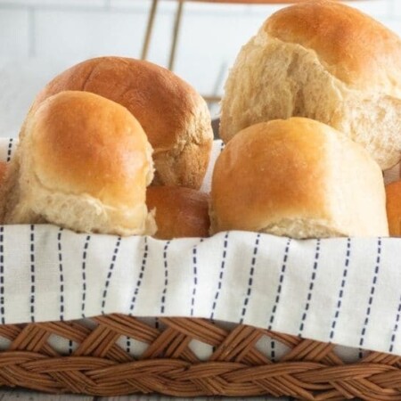 dinner rolls in a wooden basket